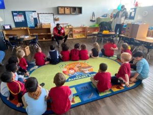 Malik Olafioye reading to the kids at Creative Montessori Academy